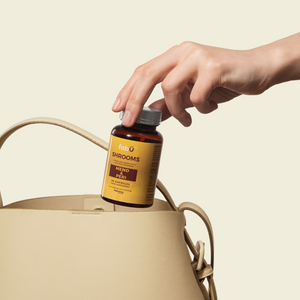 fabU SHROOMS MENO AND PERI bottle being placed into a bag